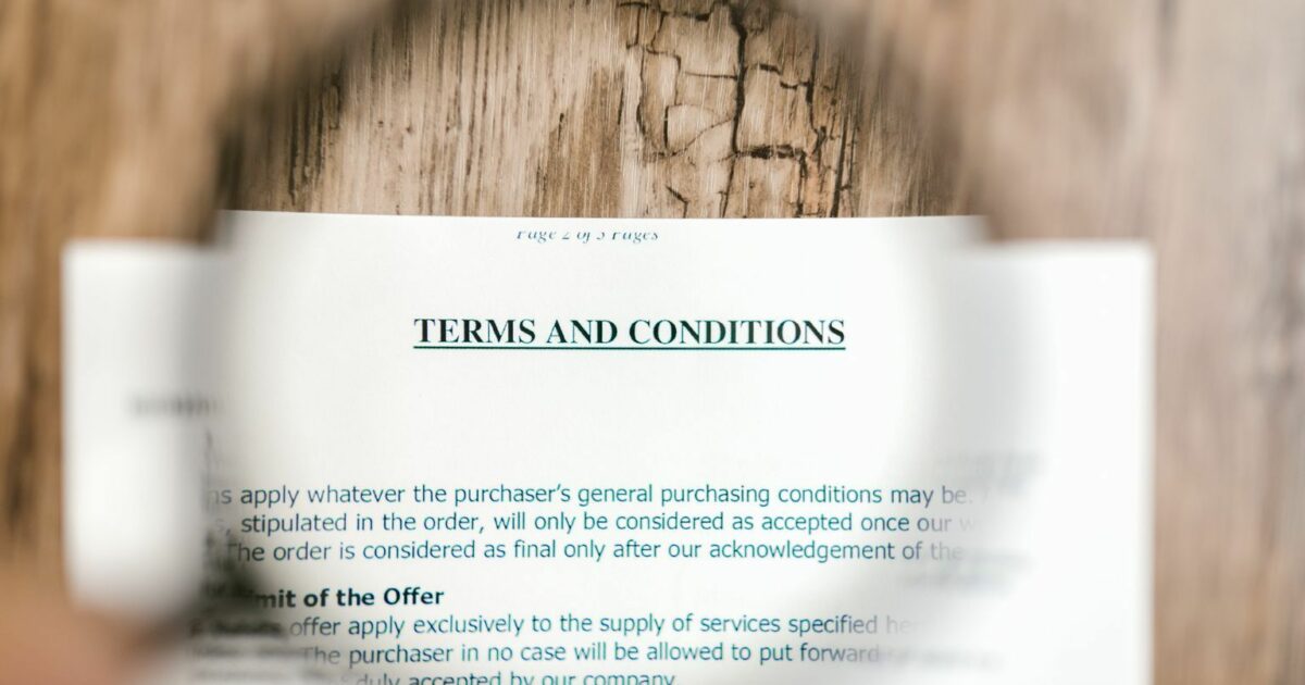 Selective Focus Photo of Terms and Conditions Written on a Paper